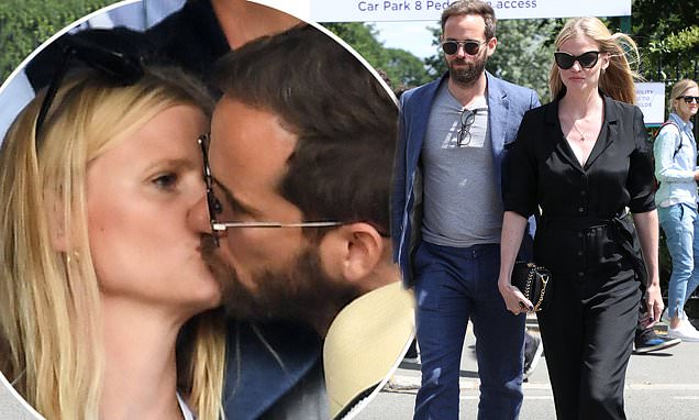 Lara Stone puckers up to boyfriend David Grievson at Wimbledon as she dons chic black jumpsuit