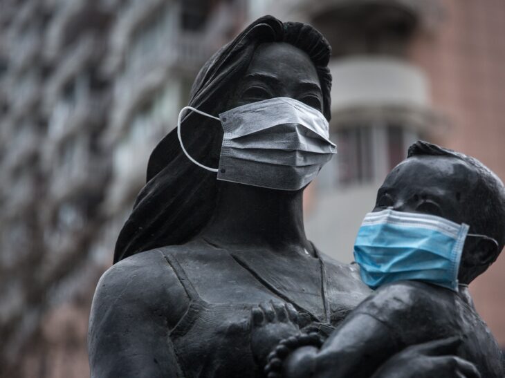 People are putting face masks on statues across the world to promote social distancing