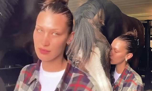 Bella Hadid gives her beloved horse a kiss as she isolates with family