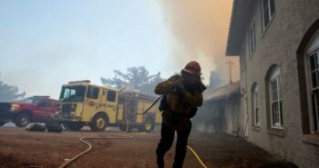 California firefighters race to subdue flames before heat and winds return – Reuters